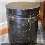 F15. Black side table with buckles. 20”h x 16” 